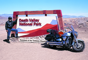 The Death Valley welcome sign coming over the Inyo Mountains on Route 190.