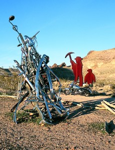 These sculptures can be found in the ghost town of Rhyolite, a little west of Beatty; the presence of the penguin is an artistic mystery.