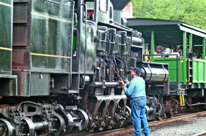 An engineer tends a Shay locomotive in Cass, West Virginia.