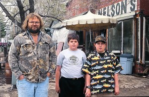 Muscoda resident Tom Nelson poses with two local art patrons.
