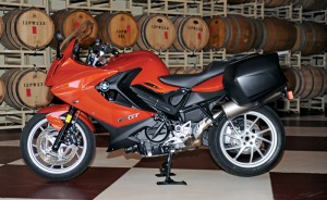 A wider fairing and larger windscreen provide more wind protection, and the bike rolls on lighter, restyled wheels.