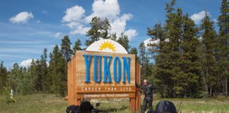 The author entering the Yukon Territory on the Alaska Highway at Watson Lake