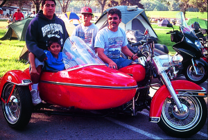 Sidecar family…dad Tony, sons Dominique, Damian and Demetri travel aboard a 1979 H-D with sidecar.
