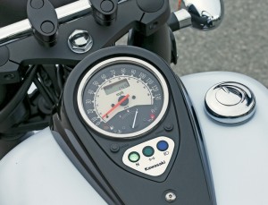 Black tanktop console includes a speedometer, fuel gauge and an LCD clock/odometer/tripmeter.