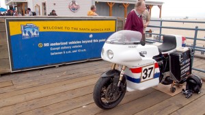 The Moto-Electra bike at Santa Monica Pier, after its record-setting transcontinental run.