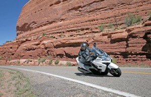 Although steering is rather slow, the Kymco MyRoad 700i holds a line well and is capable of deep lean angles.