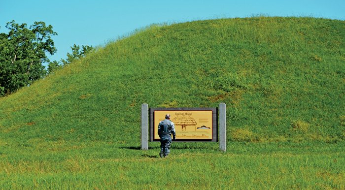 A fellow rider is dwarfed by the Emerald Mound, a sacred Native American site.