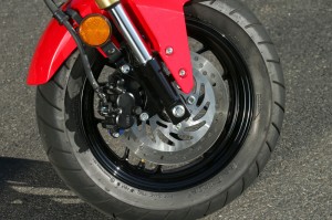 The single front disc with 2-piston caliper provides ample stopping power for the 225-lb Honda Grom.