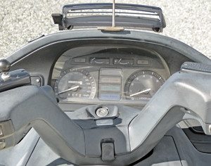 Instrument panel and plastic-covered handlebars on the 1989 Honda PC800 Pacific Coast.
