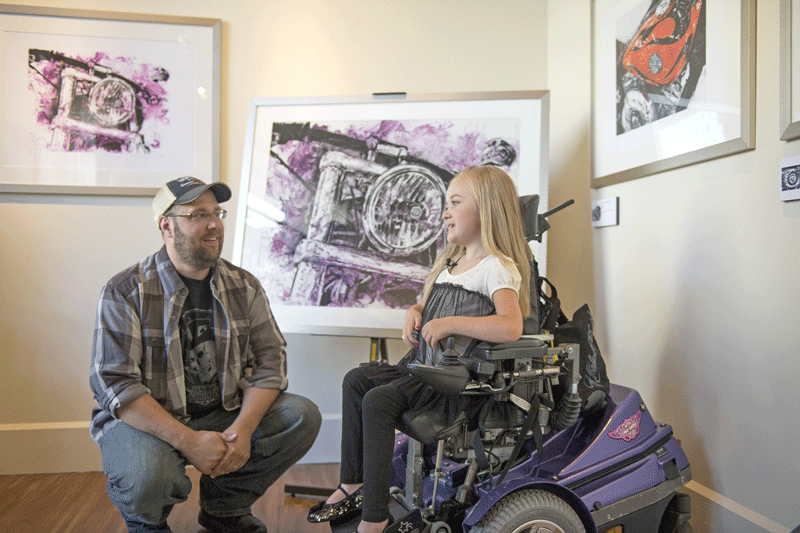 Harley-Davidson designer Mathew Hintz and Muscular Dystrophy Association Ambassador Reagan Imhoff.