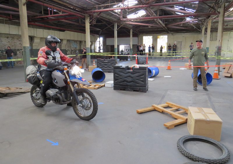 Jim Hyde was one of the judges following each rider through the indoor debris course with a point being charged for each dab or hit of an obstacle. The riders were not allowed to view the course in advance of their run.