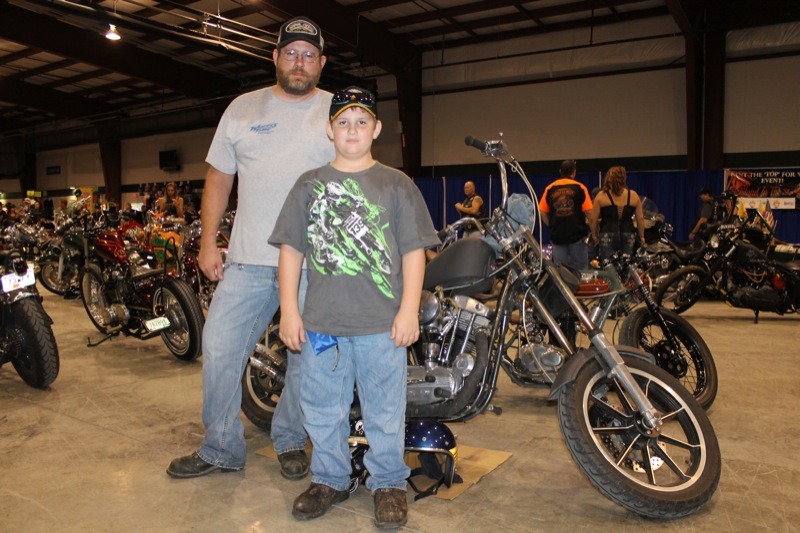 Jarrad and Jacob Haddix stand with their custom ’68 Sportster