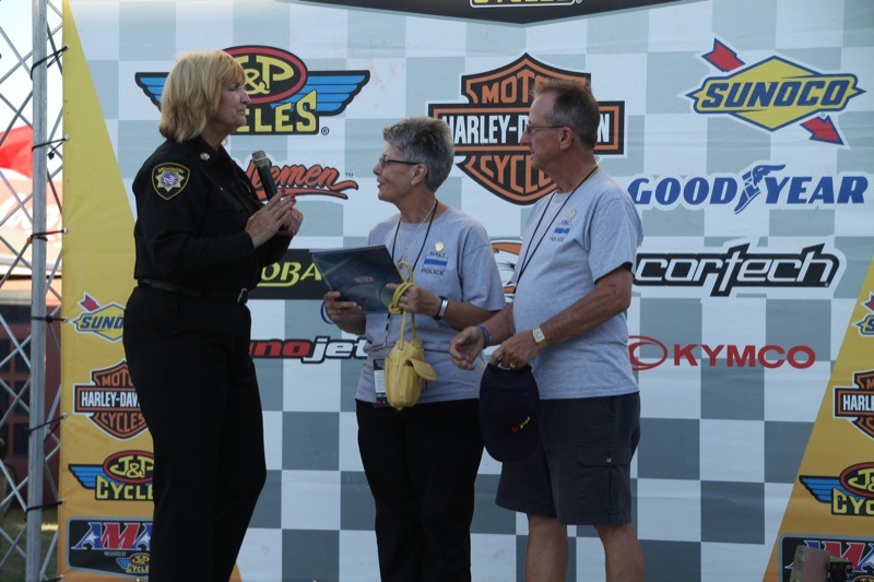 Chaplain Russell presents a plaque to Mary Ann and Will Tonn at the Sacramento Mile