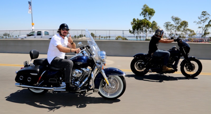Kim Coates flies a thumbs up as Theo Rossi hammers the throttle en route to the Battleship U.S.S. Iowa