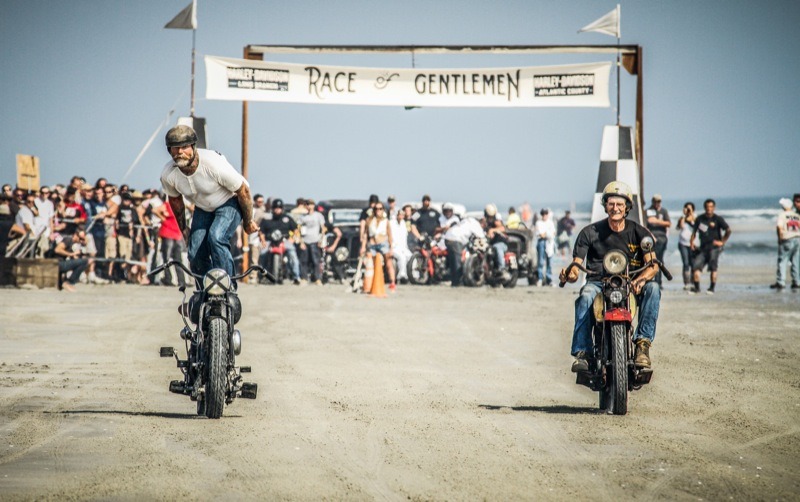 Mel Stultz does some fancy racing standing on his 1939 Indian Chief against “Stretch” on his 1927 Harley-Davidson JD