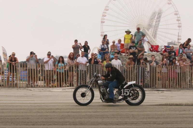 Pete Minardi and his ’31 Indian scorch the sandy strip in front of the spectators