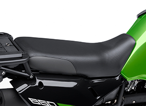 The KLR650 New Edition's seat is an inch wider and has a dimpled cover.