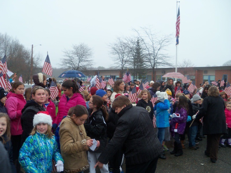 Students at Pine Grove Elementary School in Rowley, Massachusetts, greet the escort