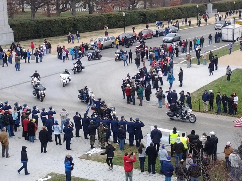 Riders and tractor trailers carrying more than 140,000 wreaths arrive at Arlington National Cemetery