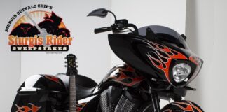 The Ness-customized Victory Cross Country 8-Ball and matching Epiphone guitar for Buffalo Chip's 2014 Sturgis Rider Sweepstakes