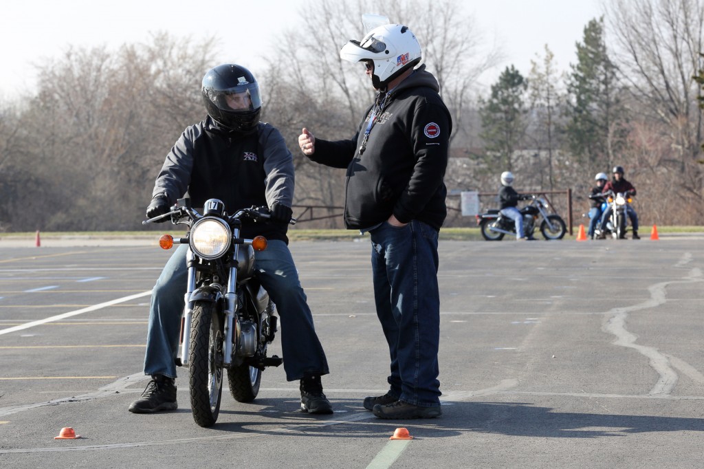 A student receives instruction from an MSF RiderCoach, during MSF’s first-ever, updated Basic RiderCourse, taught over the weekend at the Johnson County Community College motorcycle safety-training site in Overland Park, Kansas.