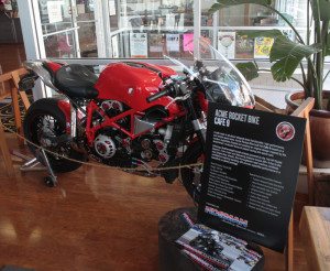 Near the front door is Cafe 9, a custom Ducati cafe racer built by Acme Rocket Bike.