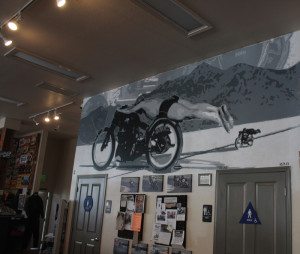 Mural of an iconic image of Rollie Free honors the cafe's namesake, the Vincent Black Lightning.