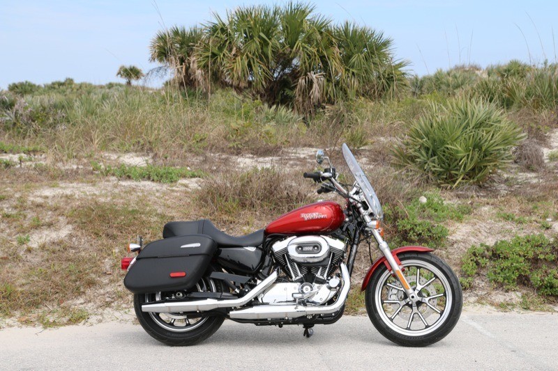 The SuperLow 1200T is the first Sportster to feature factory-equipped saddlebags and windshield as standard gear