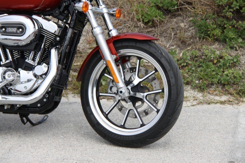 Michelin Scorcher 11T touring tires wrap the black and silver split five-spoke aluminum wheels