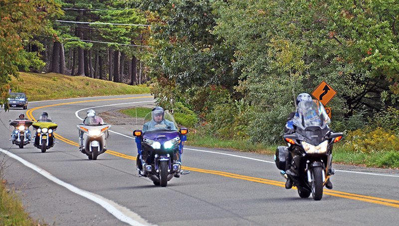 Riders near the lake.