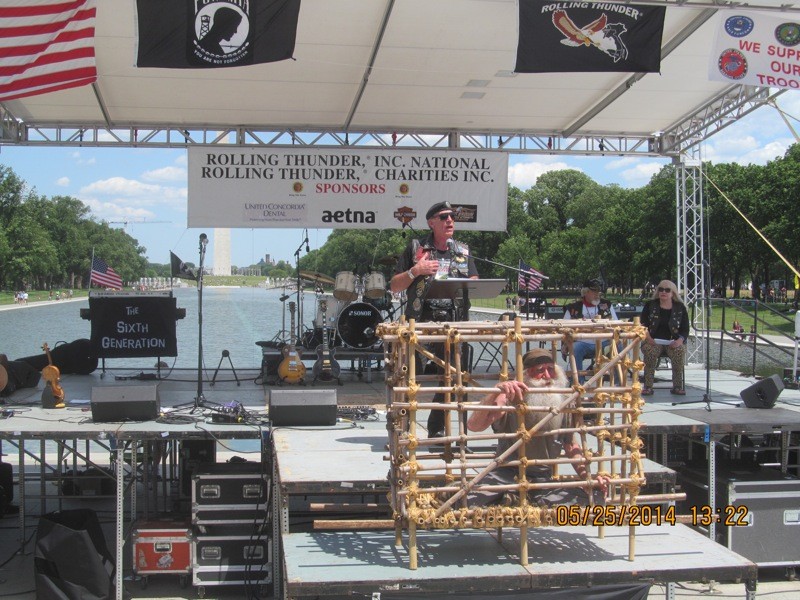 Rolling Thunder, Inc. co-founder Artie Miller delivers a passionate M.I.A. issues at the Washington Monument reflecting pool
