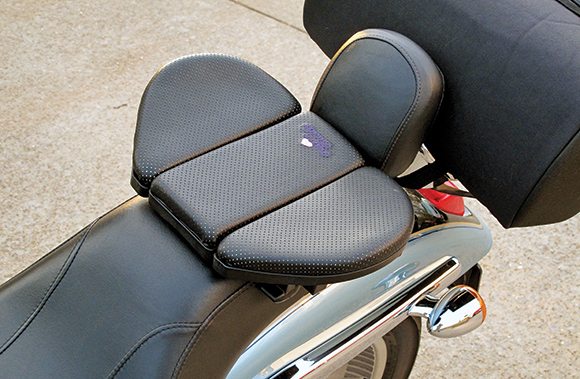 The Butty Buddy is a portable seat, which overlays a motorcycle's small passenger seat or rear fender.