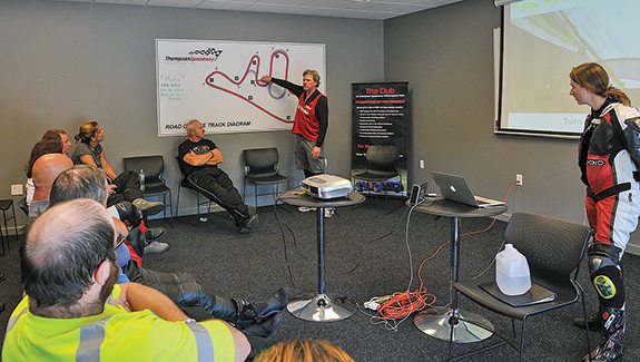 In this classroom session, riders get pointers for carving a smooth line through the tricky double-apex turn. 