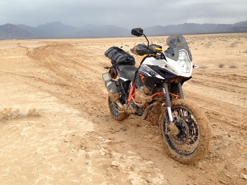 Thick, cakey mud proved to be too much for the KTM 1190 Adventure R's front fender. (Photo by Greg Drevenstedt)