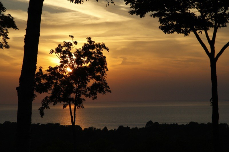 Watching the sun sink into the Green Bay from the deck at the Landmark Resort is an evening treat (www.thelandmarkresort.com)