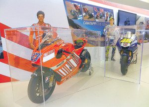 Even the Ferrari Museum is motorcycle crazy: This display commemorates the 2008 pass Vale Rossi made on Casey Stoner in Laguna Seca’s Cavatappi (Corkscrew). 