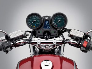 Honda nails the old-school look with the twin round gauges, chrome, Candy Red paint and sculpted fuel tank.