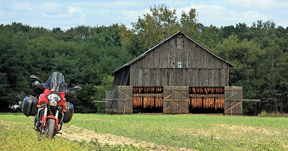 Slats tilted out and broadleaf air-curing in neat tiers, tobacco sheds are slowly vanishing from the rural landscape of the Connecticut River Valley. 