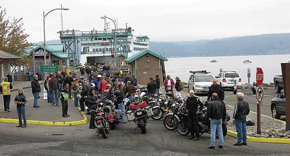 Motorcycles and riders are waiting patiently to get on the ferry for the short trip to Vashon Island, where the annual Isle of Vashon TT is taking place and a thousand or more bikes will show up.