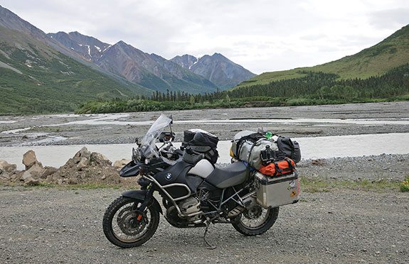 Fully loaded in the middle of Alaska and ready to set up camp. Note the two smaller waterproof bags on top of the panniers to keep items like rain liners and different gloves easily accessible.