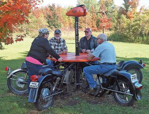 At the Motorcycle Memorial maintained by the Northeastern Wisconsin Bikers Association, visitors gather around a one-of-a-kind picnic table.