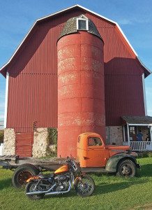 Color matching of Sportster, barn and truck makes for nice photo composition.
