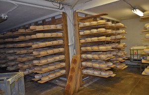 Cheese sits on shelves while aging in a secret Vermont location.