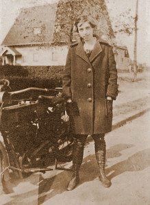 In this pre-journey shot, ca. 1914, Effie proudly stands by her motorcycle. She is probably in her Brooklyn neighborhood. She went through a series of used machines before buying a new Harley-Davidson for the journey. 