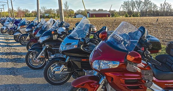 Motorcycles lined up by a still unplowed field are a clear sign that it’s time for Moonshine.