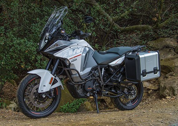 Although equally wide across the back, the KTM has slimmer proportions in front and a lower seat height, and weighs 25 pounds less with the cases installed on both (standard on the KTM, optional on the BMW).