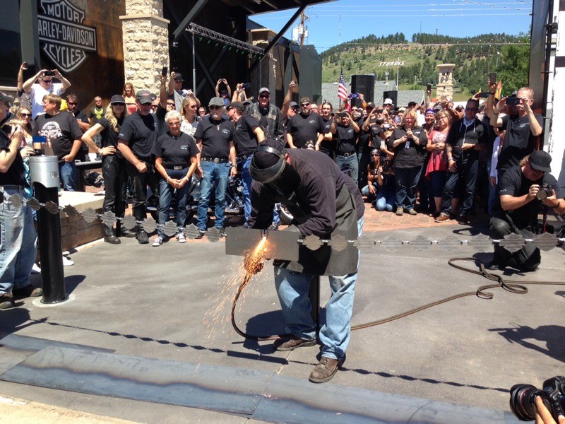 As Willie G. and the Davidson family looked on, a chain-cutting ceremony officially welcomed riders to the new Rally Point at Main Street and Harley-Davidson Way