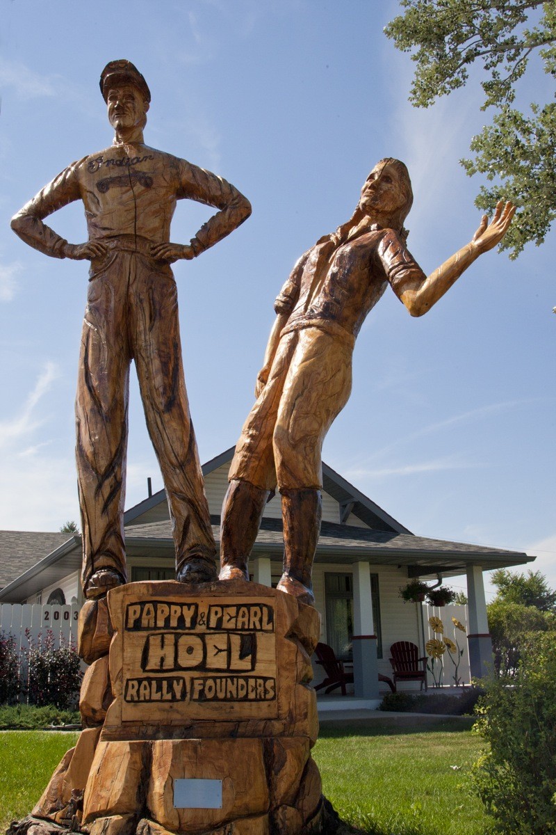 A tree carving honors rally founders J.C. “Pappy” Hoel and his wife Pearl in front of the family homestead on Junction Street in Sturgis