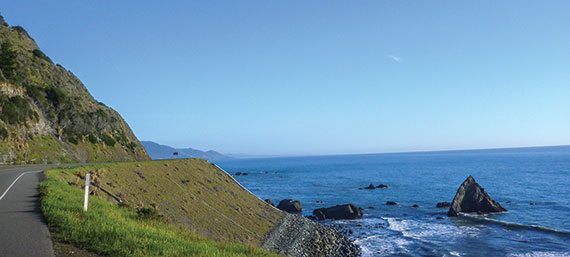 The Pacific Coast Highway looking south toward Mendocino, California. Late afternoon glow set the hills to a golden color.