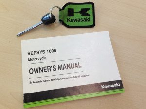 We keep the owner's manual for our Kawasaki Versys 1000 LT long-term test bike under the seat.